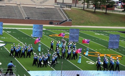 MAKING BEAUTIFUL MUSIC. The band performs Into the Blue, their marching program for the judges at area competition. 