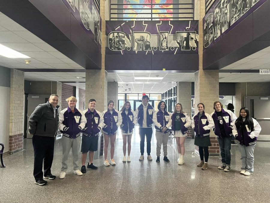 HARD WORK PAYS OFF. Shortly after receiving letter jackets, the top 10 students in the senior class of 2023 group together for a picture. The jacket signifies the hard work and dedication that these students put forth into their academics. (From left to right) Principal Chad Smith, Reid Henderson, Logan Hoover, Lauren Hues, Lindsey Hues, Hutton Hoegemeyer, Jonathan Rodriguez, Rylee Neumann, Marion Opel, Peyton Sewell, Ivy Nguyen.