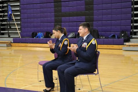 NEW COMMANDER. At the Change of Command ceremony, seniors Jasmine Rodriguez and Josh Baldwin wait for their moment in the event. 