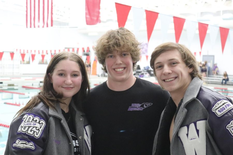 ONE LAST HURRAH. During senior night, seniors Lainey Osborn, Brooks Cesan, and Peyton Sewell get together to share a memory with each other. The three were recognized for their dedication to Aquakats and much more.