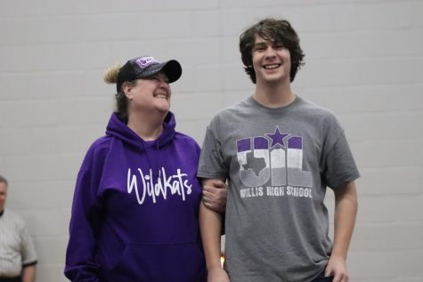 THANKS MOM. On senior night, senior Michael Scholwinski is accompanied by his mom Kim. The seniors of the boys and girls teams were honored before their match this week. 