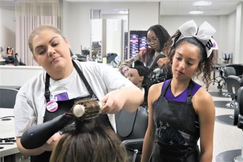 WATCH AND LEARN. During an advanced cosmetology class senior Emma Atkinson learns from instructor Carla Hernandez. 