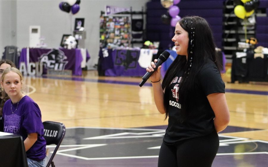 SIGNING DAY. Addressing the crowd in the gym, senior Lucy Smith talks about her college plans before the signing day ceremony. Smith will continue her soccer career at TSU next year.
