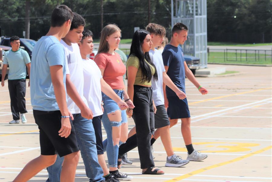 During Wildkat way senior Lily Barron teaches cadets how to perform drill movements. First year cadets need to learn drill movements because it’s a requirement in JROTC.
