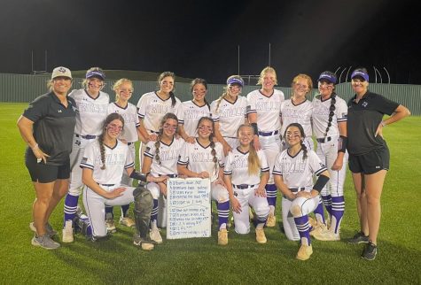 GOALS MET. After the victory against Grand Oaks, the varsity softball team takes a victory photo with their completed whiteboard goals. The team is 3-0 in district and at the top of district 13-6A.