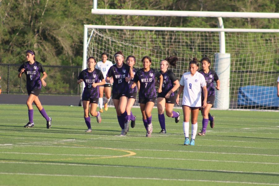MIND ON THE GAME. After scoring the first goal at the game against Aldine, the team takes their places on the field. 