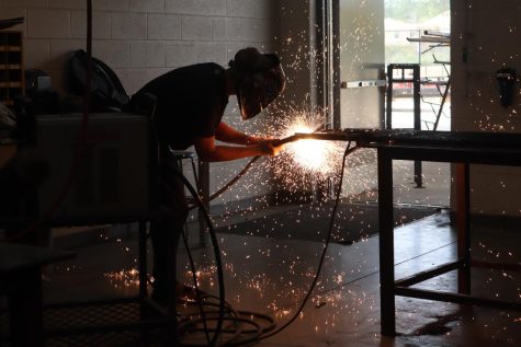 BONDING TIME. Working on a project, a welder makes sparks fly. Wearing the proper safety mask is important during welding to avoid injury to the eyes. 