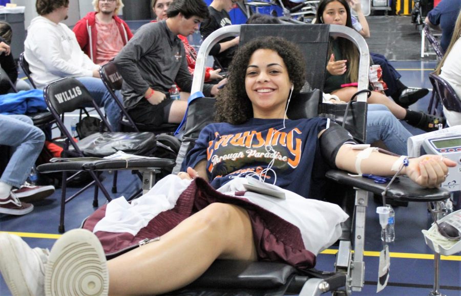 SAVING LIVES. Saving three lives in the process, senior Persais Simpson donates blood during the spring HOSA drive. Willis High School donated enough blood to save over 200 lives.