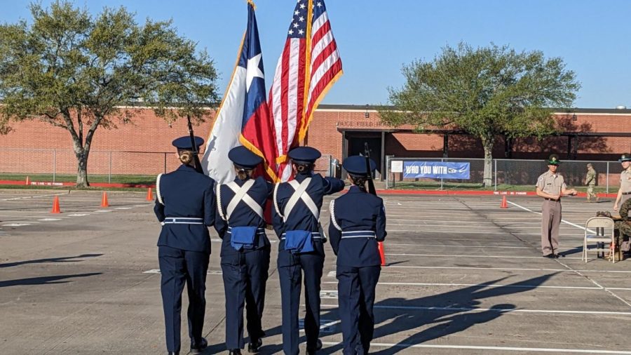 LEFT WHEEL, MARCH. The secondary color guard team is performing their routine.  These cadets put much work towards their goal and it paid off.