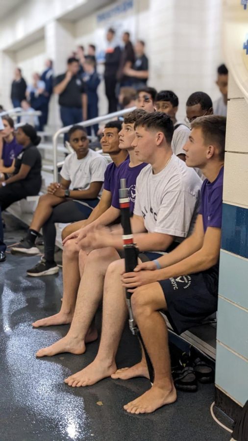RANGERS READY. Swimmers, senior Bernardo Salazar, freshman Drake schwartz, senior Joshua Baldwin, and  junior Keitan Schwartz are getting briefed on challenges they will perform. This was the first time WHS AFJROTC has competed in the Ranger swim event.