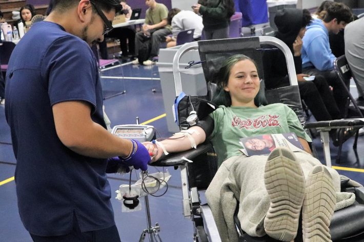 SAVING LIVES. Saving three lives in the process, junior Rebecca McDowell donates blood during the spring HOSA drive. Willis High School donated enough blood to save over 200 lives.