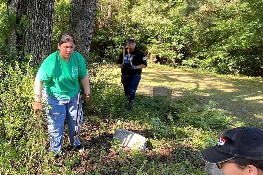 DOING THEIR PART. Members of AFJROTC aide in the clean up of the Rest Haven Cemetery.