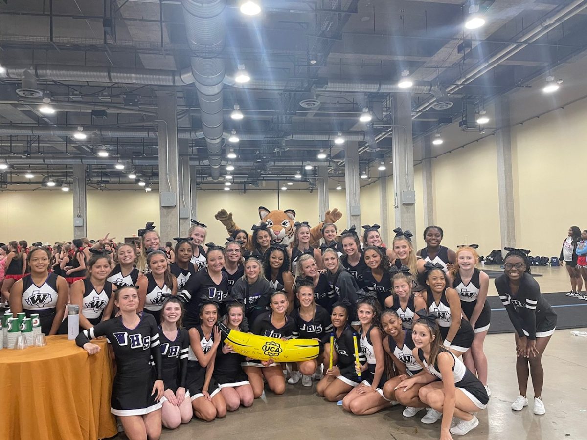 LETS GO CRAZY. The cheerkats win the spirit stick at the Annual UCA camp. UCA camp was a great place for them to learn new material and build camaraderie. photo courtesy of Wildkat Cheer

