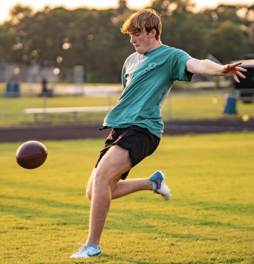 KICKING+FOR+A+CAUSE.+Practicing+his+skill%2C+junior+Justin+Willis+kicks+the+football.+Willis+is+raising+money+for+a+stillbirth+campaign.+%0APhoto+courtesy+of+Justin+Willis