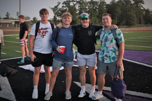 FOUR MUSKETEERS. Starting the year off with friends, seniors Travis VanSchuyver, Chance Bertrand, Jacob Gober and Devin Ostertag take a picture before the start of the first day at senior picnic. 