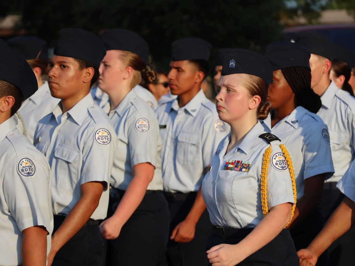 MARCHING IN STEP. With members of AFJORTC, senior Bethany Lerch finishes off the parade route with her fellow cadets. 