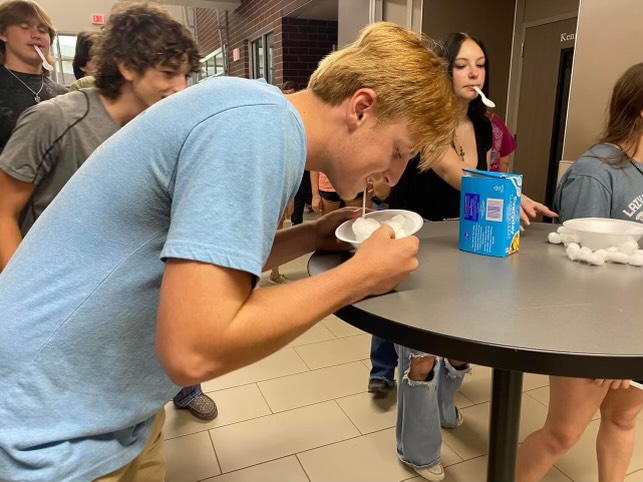 COTTON BALL FESTIVITIES. Fun challenges occur in the AG building, sophomore Reed Regan is scoping and scoping cotton balls. The new bonds that occur in the AG building connect not only ones animals to themselves but also each other