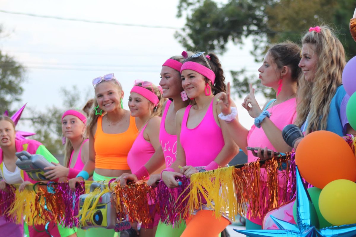 PRETTY IN PINK. Members of the softball team goes back to the 80s at the 2023 homecoming parade. This year's homecoming theme is Games Wildkats Play.