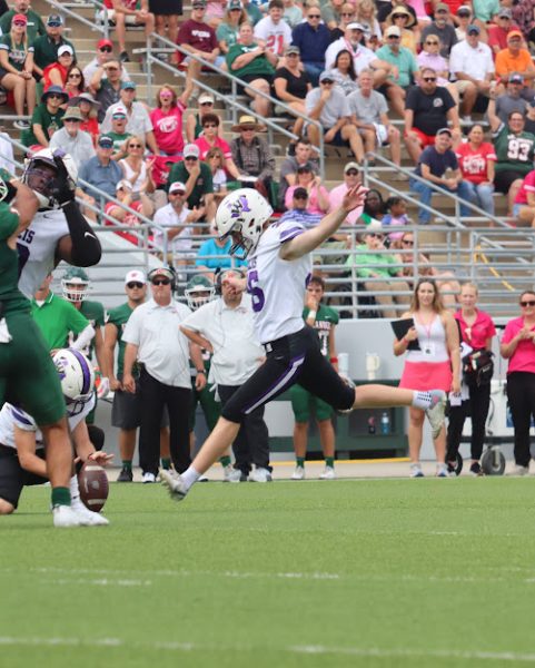 TAKING CARE OF BUSINESS. Making the biggest play of the game, junior Justin Willis makes his 45-yard field goal in the game Saturday against The Woodlands. 