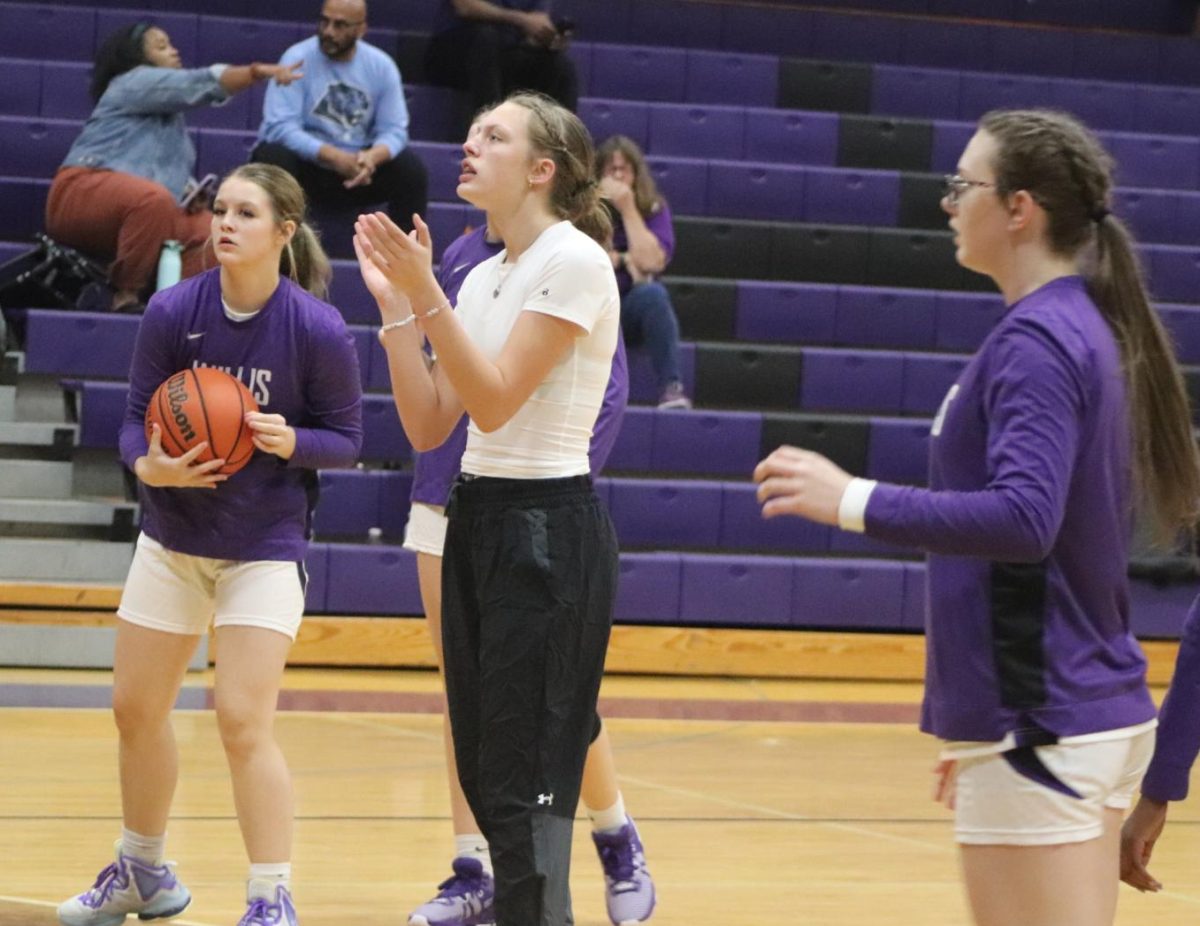READY TO PLAY. Junior Gabrianna Mize and sophomore Meagan Pierce prepare for their basketball game during halftime. The girls next basketball game of the season will occur at Tomball Memorial on November 14th. 
