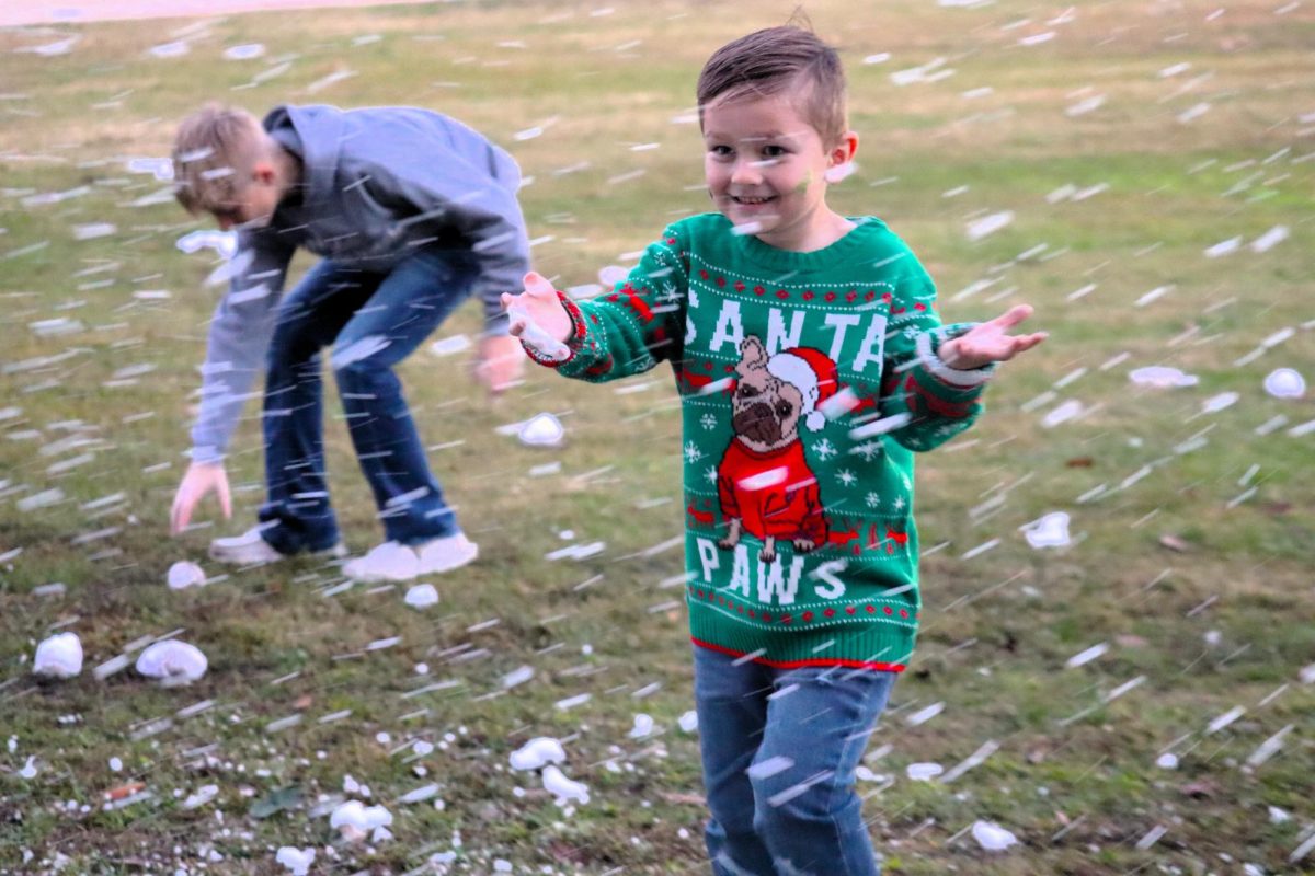 LET IT SNOW. Having a blast with the snow provided by the WISD Educational Foundation, a student enjoys Christmas in the Barn.