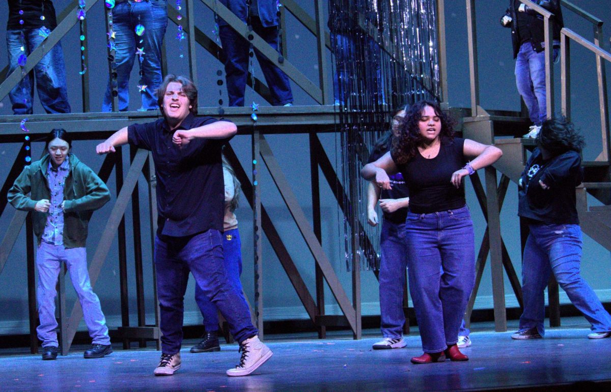 JUST DANCE. Playing the roles of Ren McCormack and Ariel Moore, seniors Aiden Hamilton and Gracie Saucedo show off a scene of Footloose for the eighth graders visiting from Lynn Lucas Middle School on Monday. 
