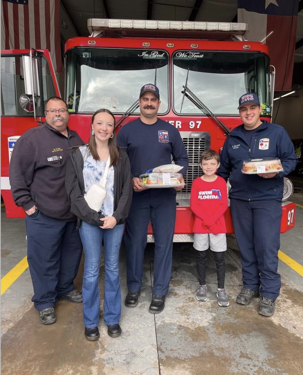 SPECIAL DELIVERY. During the winter break, sophomore Annabell Smith-Grimm delivers treats and sandwiches to a Montgomery County Fire station. She visited all the stations to share a message of positivity to the first responders. courtesy of Annabell Smith-Grimm