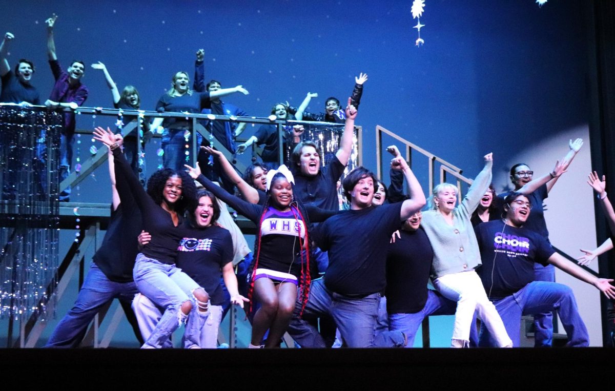 PUT ON YOUR DANCING SHOES. Members of the cast of "Footloose" preview the ending song of the musical for the eighth graders from Lynn Lucas Middle School during their tour of the high school on Jan. 22. photo by Alyssa Meier