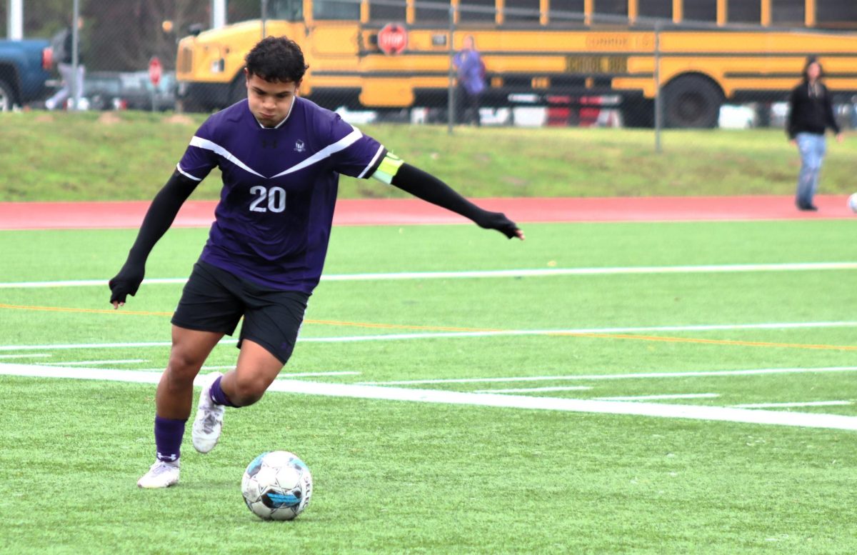 LEADER OF THE PACK. Battling the cold, rainy weather, senior and team captain Noe Gallaga focuses on the ball during the game against Aldine Eisenhower during the home tournament at Wildkat Field. The Kats will play Bellville at 1:45 p.m. on Saturday, Jan. 6. photo by Sujeidy Ortiz