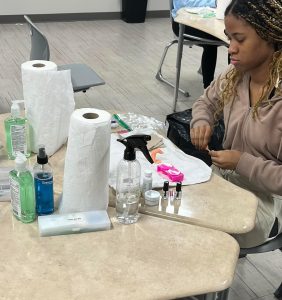 PRACTICING MAKES PERFECT. Senior Arianna Johnson works on a nail kit in the cosmetology lab as she prepares for potential career opportunities.