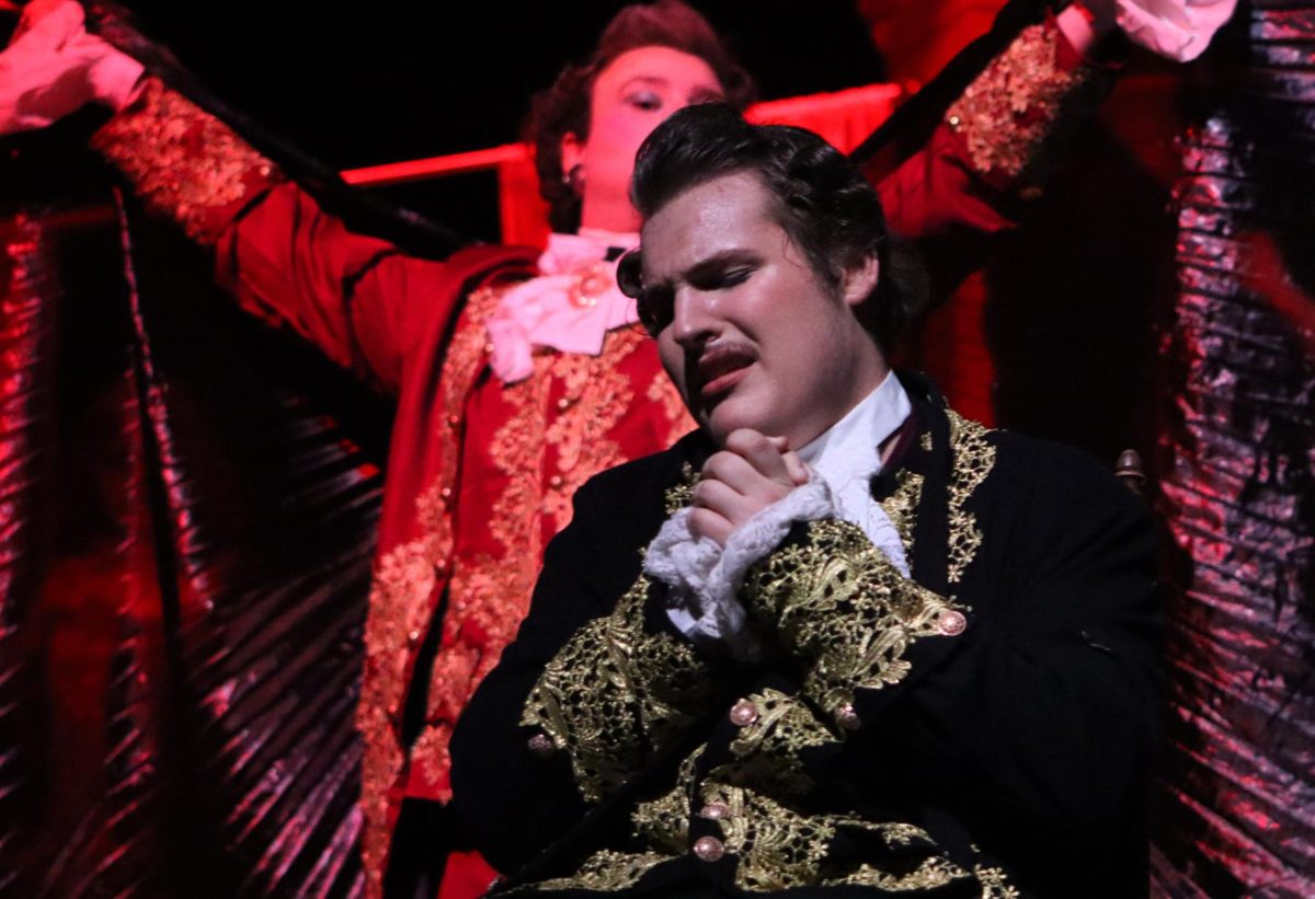 ROCK ME AMADEUS. In a scene from the One Act Plays public performance of Amadeus, Antonio Salieri, played by senior Aiden Hamilton, prays as death, played by senior Marcus Shumake, darkens the stage. At zone competition on Thursday, Hamilton was named Best Actor by the judges. Also named best actor was Breanna Keelan who played Constanze Mozart. photo by Ava Hardin