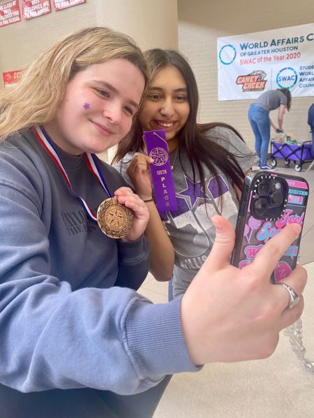 BESTIES. After feature writing results were announced junior Ella Mcdonald and senior Jakeline Diaz show off their awards.