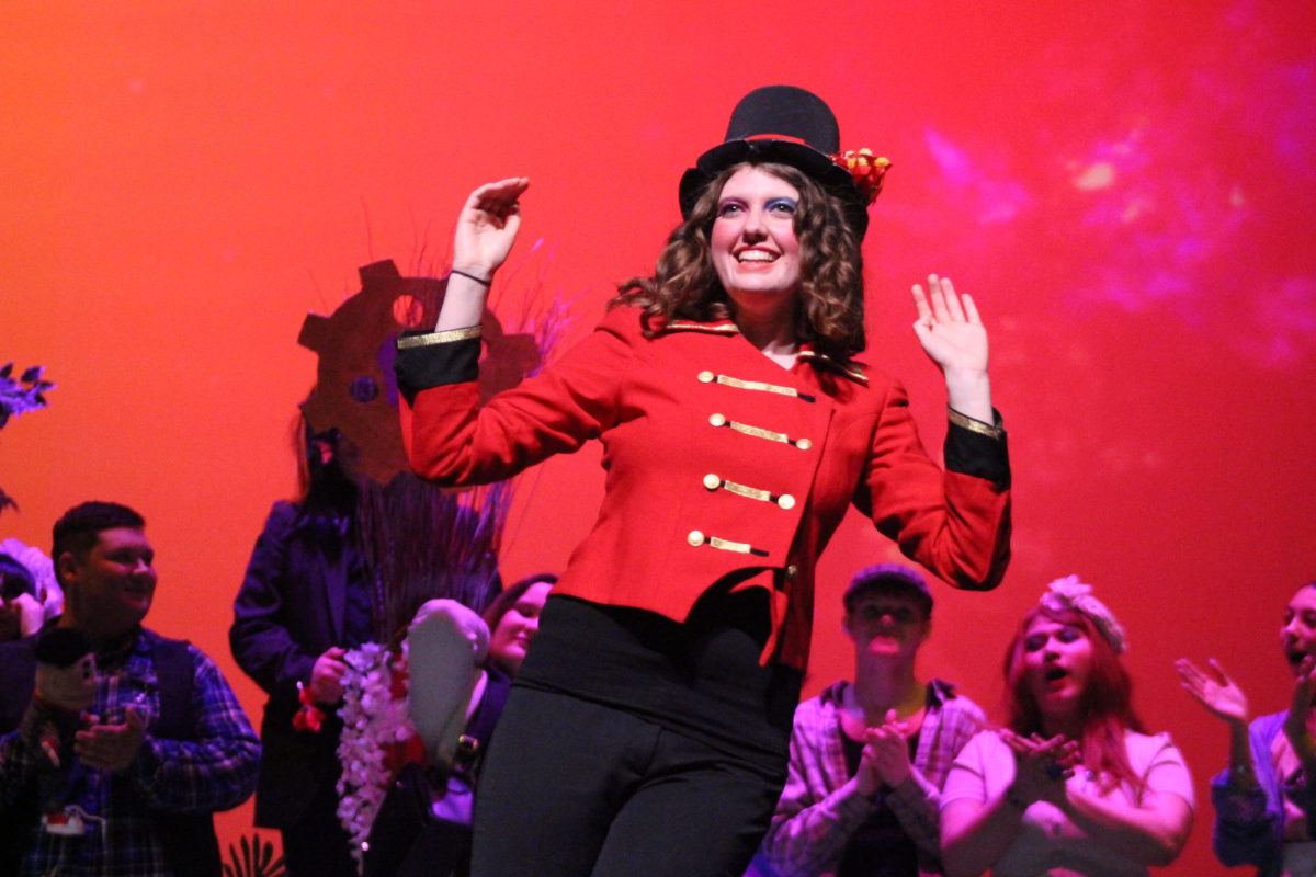MAGIC TICKET. In the DramaKats production of Charlie and the Chocolate Factory, senior Breanna Keelan ends her performance as Willy Wonka with a smile. photo by Ashley Briones