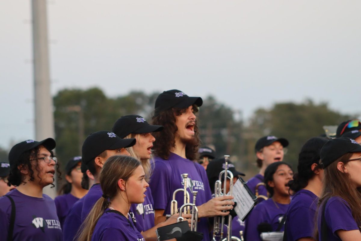 HIT. Senior Eli Maddox, Nate Riner, and junior Alfredo Bravo of the Willis Band participate in the band's dismissal after Meet the Kats. The band spent their time at Meet the Kats playing tunes for the crowd as well as helping debut the Sweethearts' new dance routine to “Runaway Baby”. “I’m so excited to kickstart the new season,” Maddox said. “This year is going to be great for the Willis Band.”