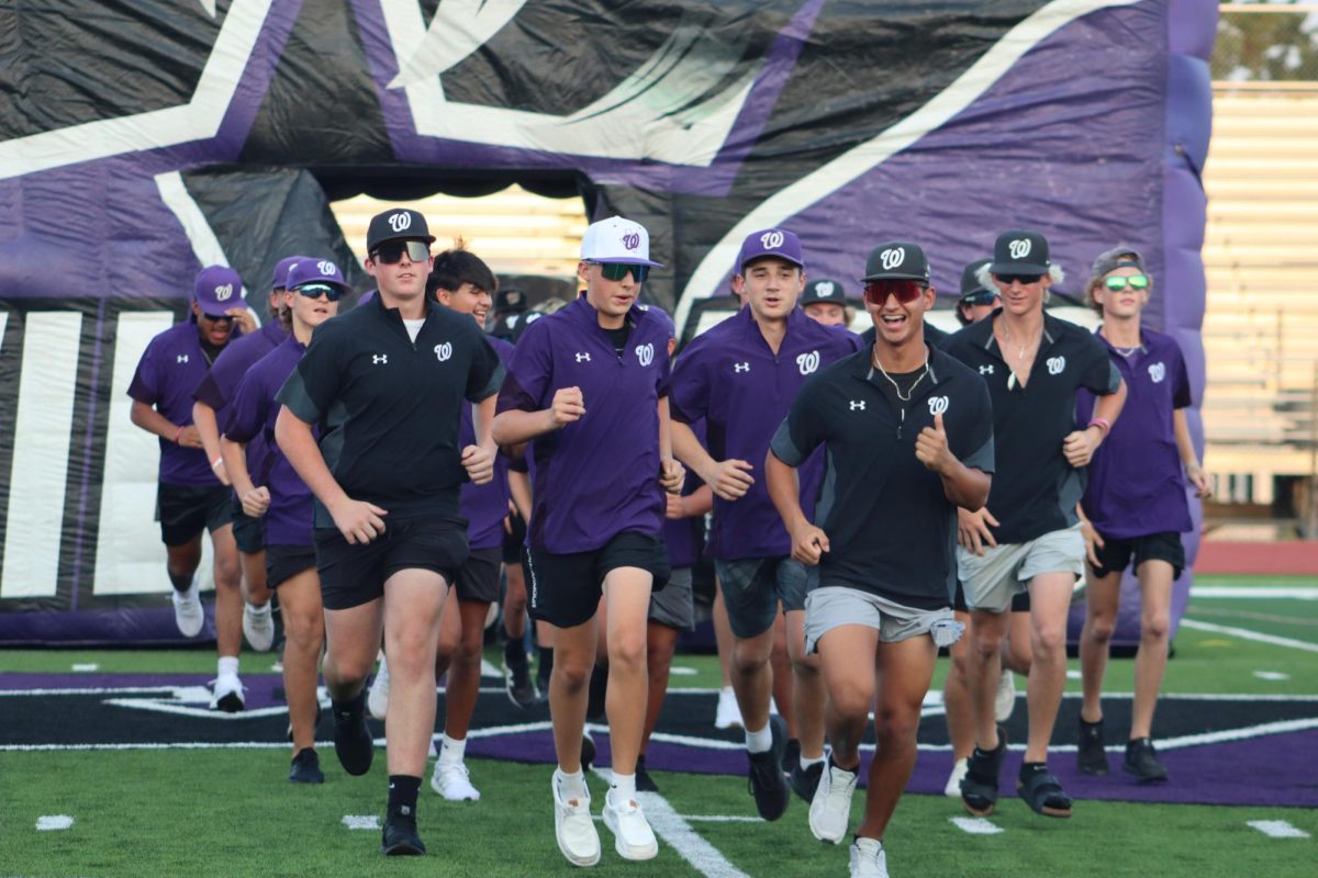 UNSTOPPABLE - The Wildkat baseball teams sprints out of the Wildkat inflatable with pure joy. During their last season, the baseball team achieved big by becoming Area and Regional Quarter finalists.