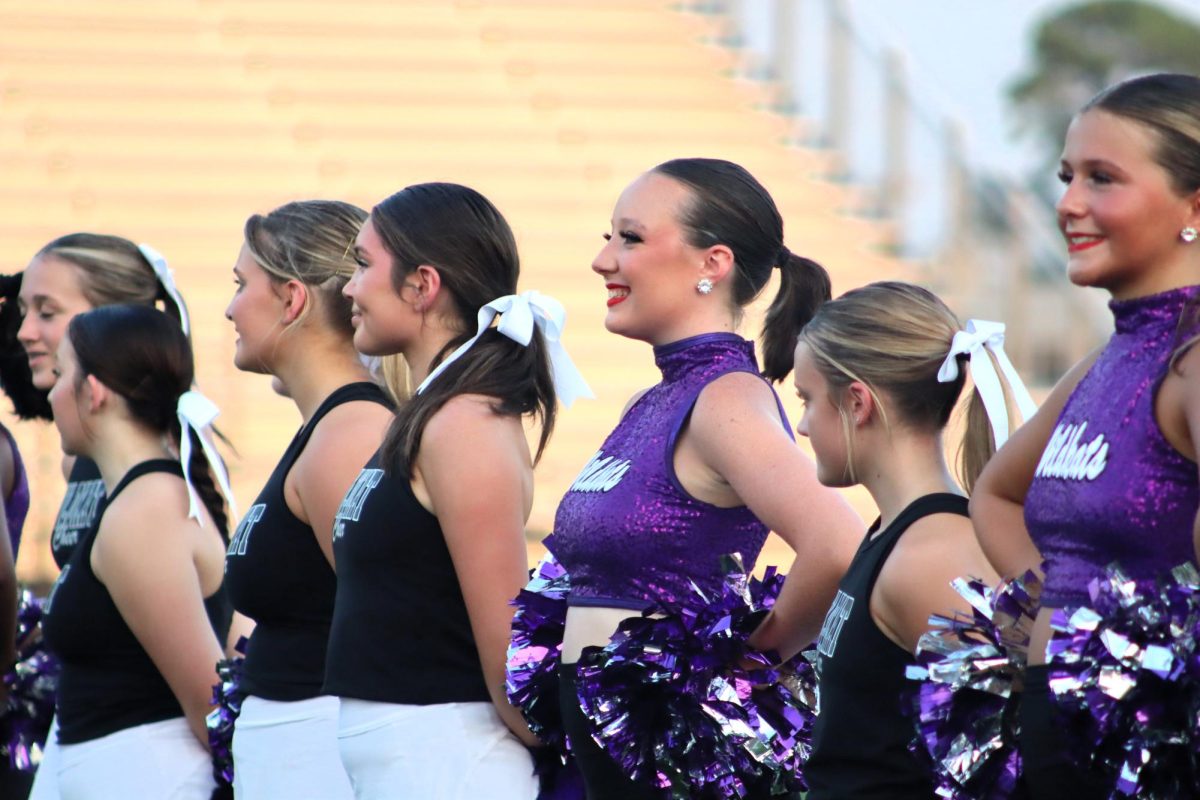 CONSTANT SMILES. After dancing a once again perfect performance, junior Annabell Smith-Grimm gets ready to hype up all sports and band members. At Meet the Kats, it was revealed that the Sweethearts will be able to perform at Pearl Harbor this upcoming season. “I know that I am so grateful for the opportunity we were provided,” Smith said. “I can't wait for what this year has in store for us.”