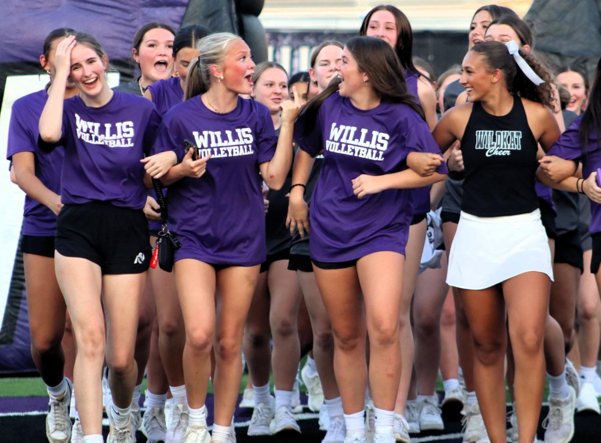 MAKING MEMORIES. The senior volleyball girls made a stand at Meet the Kats. Seniors Summer Clark, Lanie Elkins, Carly Paugh, Mylee Williams and Brianna Hendrickson show the love and friendship made through volleyball. “Willis volleyball has changed my life forever and created amazing memories and friendships we get to show off at events like Meet the Kats,” Paugh s