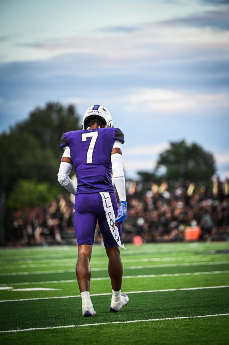 WELCOME BACK. In the season opener against Aldine Davis junior Jermaine Bishop walks onto the field for the start of the game. 