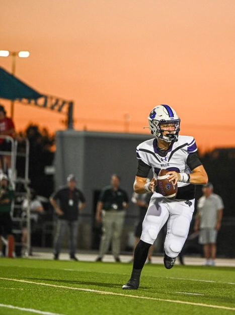 GOLDEN HOUR MOVES. Looking to complete a pass downfield, senior Jack Emerson plays at Woodforest Stadium.