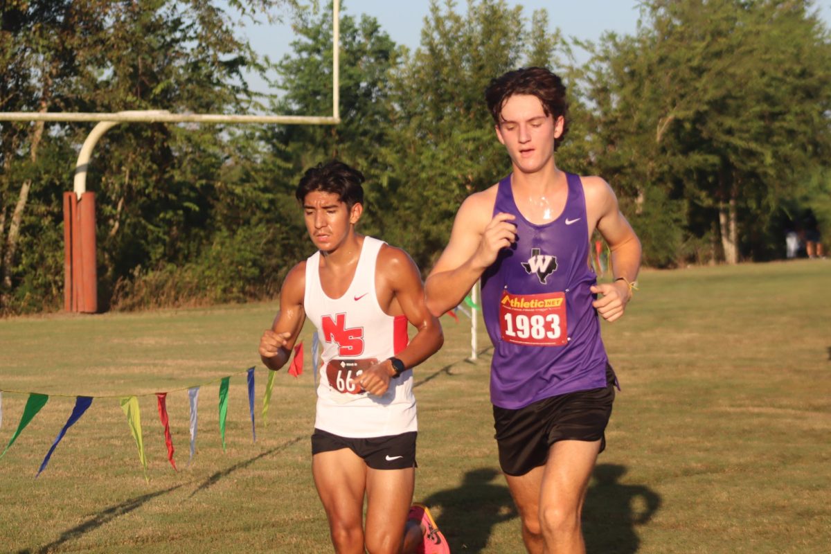 PUSHING HIMSELF. At the race at Dobie High School, senior Carson Embry paces himself to finish strong. 