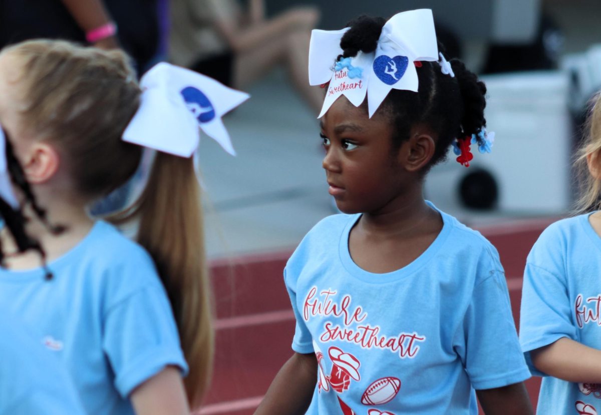 TINY DANCER. A future Sweetheart walks with the group to the victory line. 