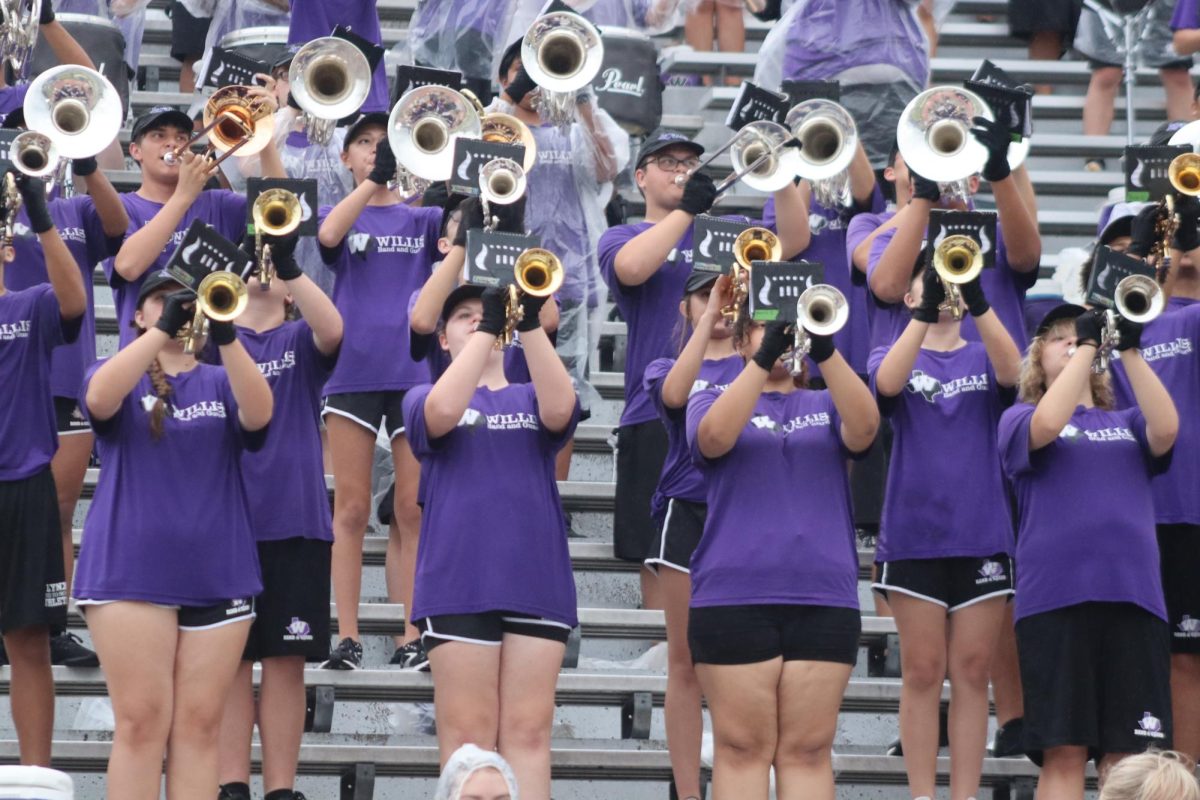 FUN IN THE STANDS. Members of the brass section play at the Thursday night game at Klein Memorial Stadium. HORNS UP. Because many of the school share stadiums, Thursday night games are necessary.