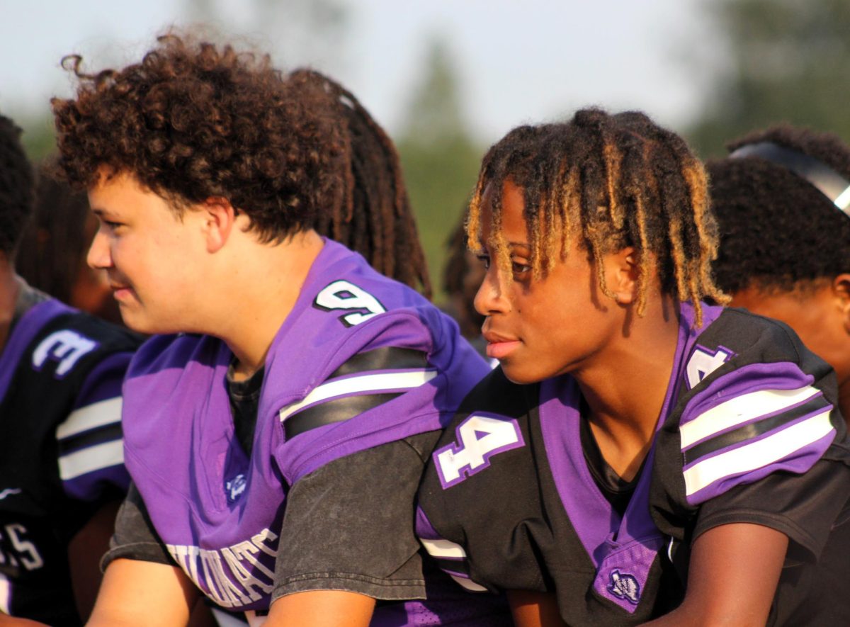 RIDING IN STYLE. With their team, freshmen Kyler Rodriguez and Jamal Lagway enjoy their first homecoming parade as high schoolers.