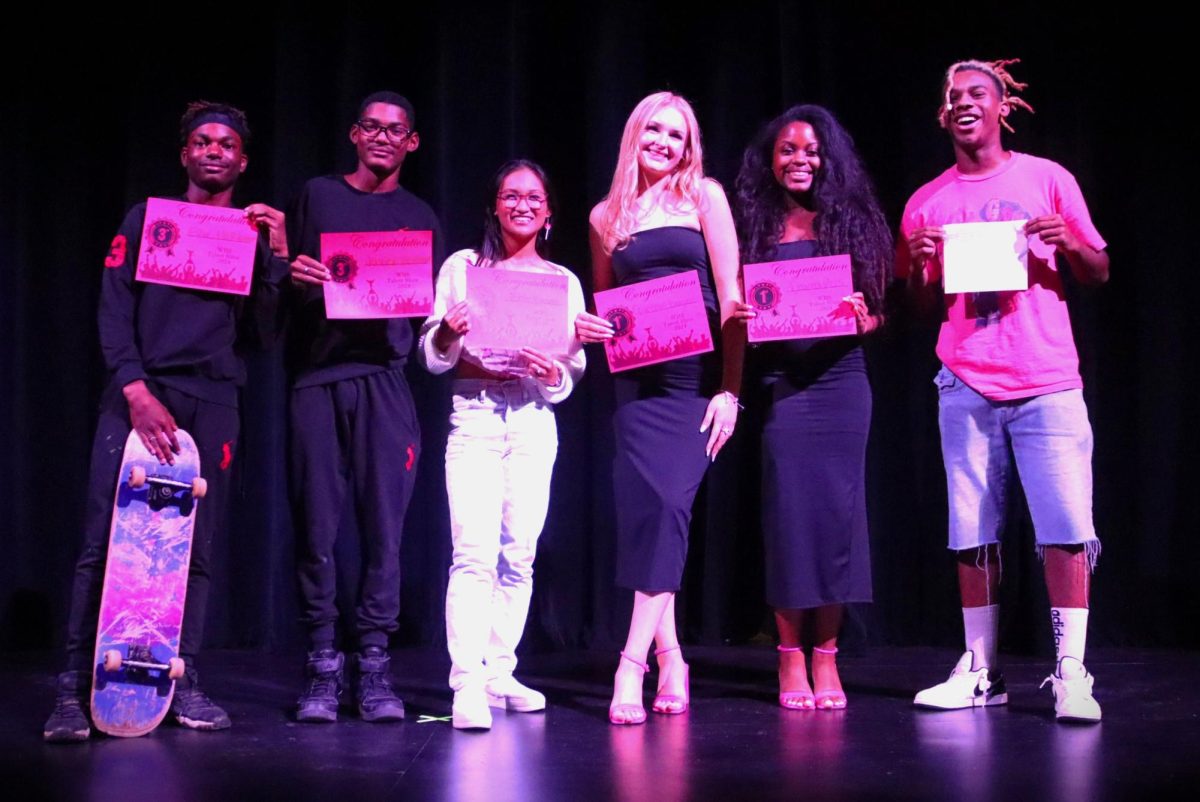 WILLIS HAS TALENT. Winners of the talent show pose after the show with the MC KJ Stevenson. Third place winners were brothers junior Javier and sophomore Eric Hebert for their dance to Beggin' by Madcon. Second place went to senior Zisel Braza for her ukulele and singing performance of the classic La Vie En Rose. The first place honors belonged to seniors Cameron Dugan and Dayna Ross for singing Stay by Rhianna. 