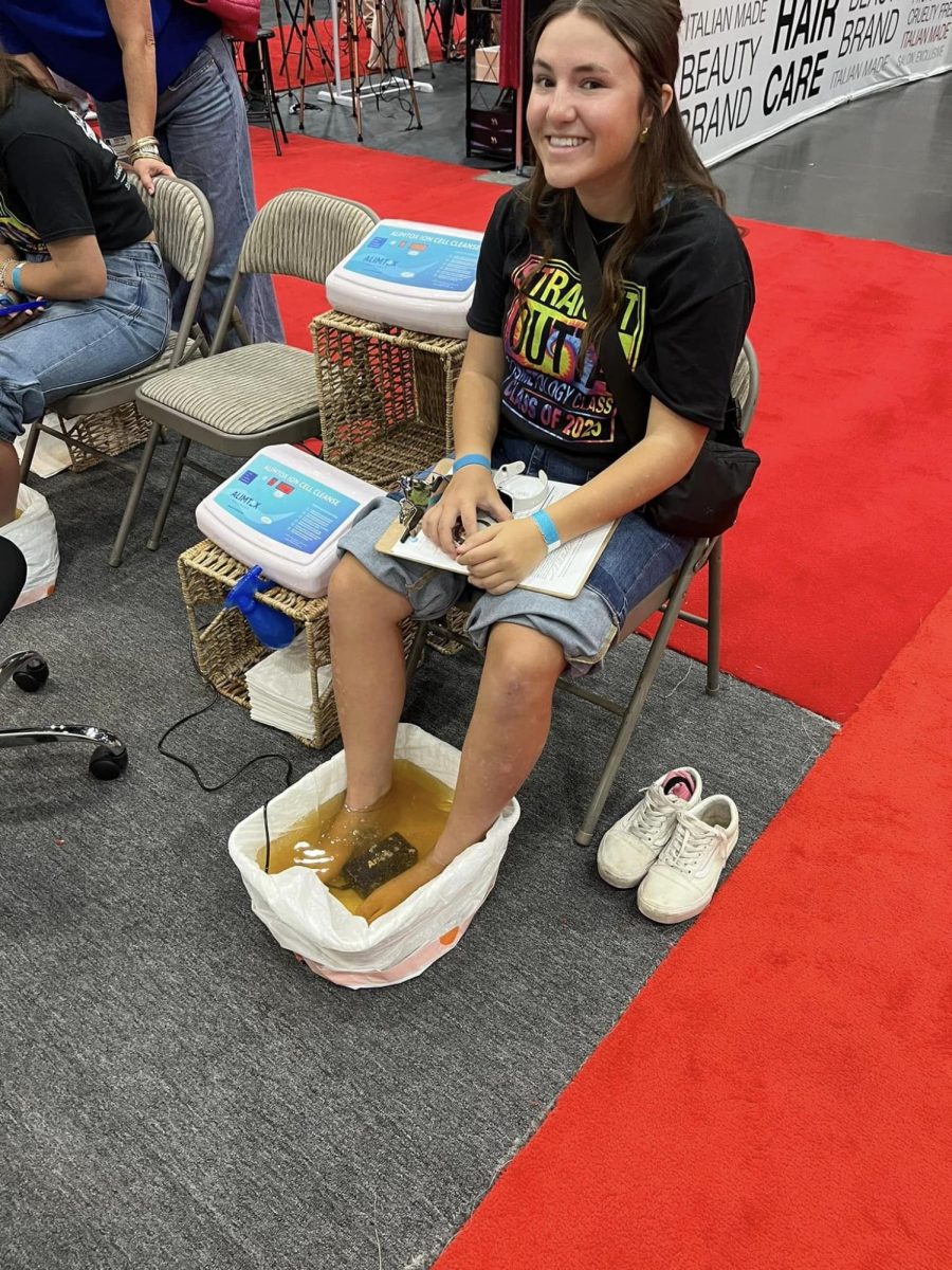 SOAKING IT ALL IN. Enjoying a pedicure demo, senior Mallori Mitchell experiences the Image Expo.