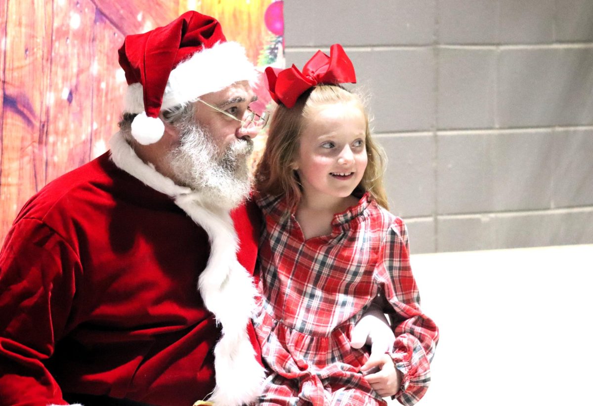 SANTA'S SWEETHEART. Pictures with Santa are part of the fun at Christmas in the Barn in 2024.