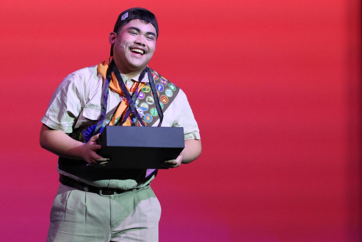 FRITOS! M&MS! OREOS! After being eliminated from the spelling bee, Mitch, played by Jhun Abarquez, comes back to the stage to sell candy and snacks and to explain his main distraction. 