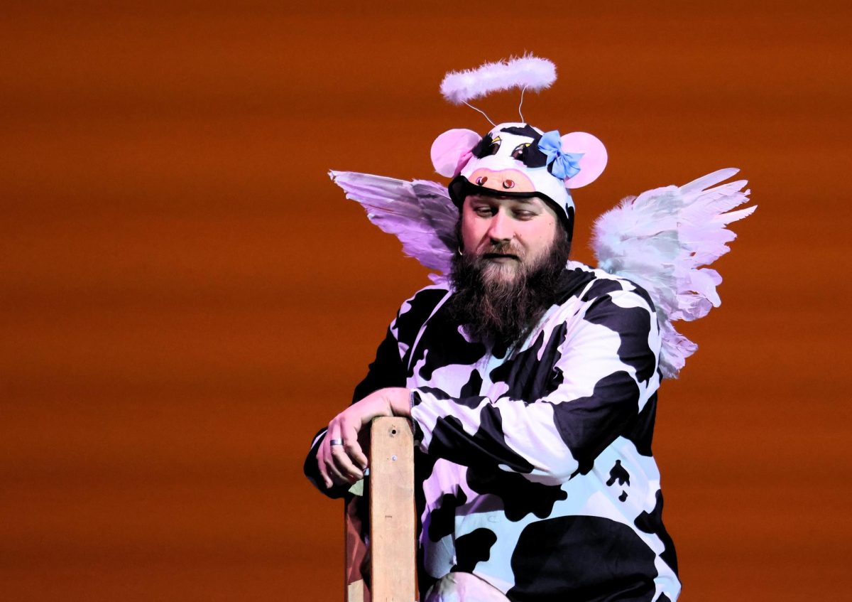 HOLY COW. English teacher Chris Slovak towers above the spellers as The Holy Cow. 