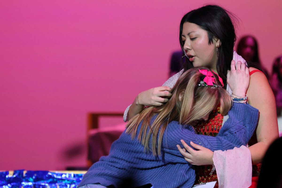 A MOTHER'S LOVE. Playing Olive's absent mother, senior Odalys Garay sings to her daughter in a touching song, "I love You."