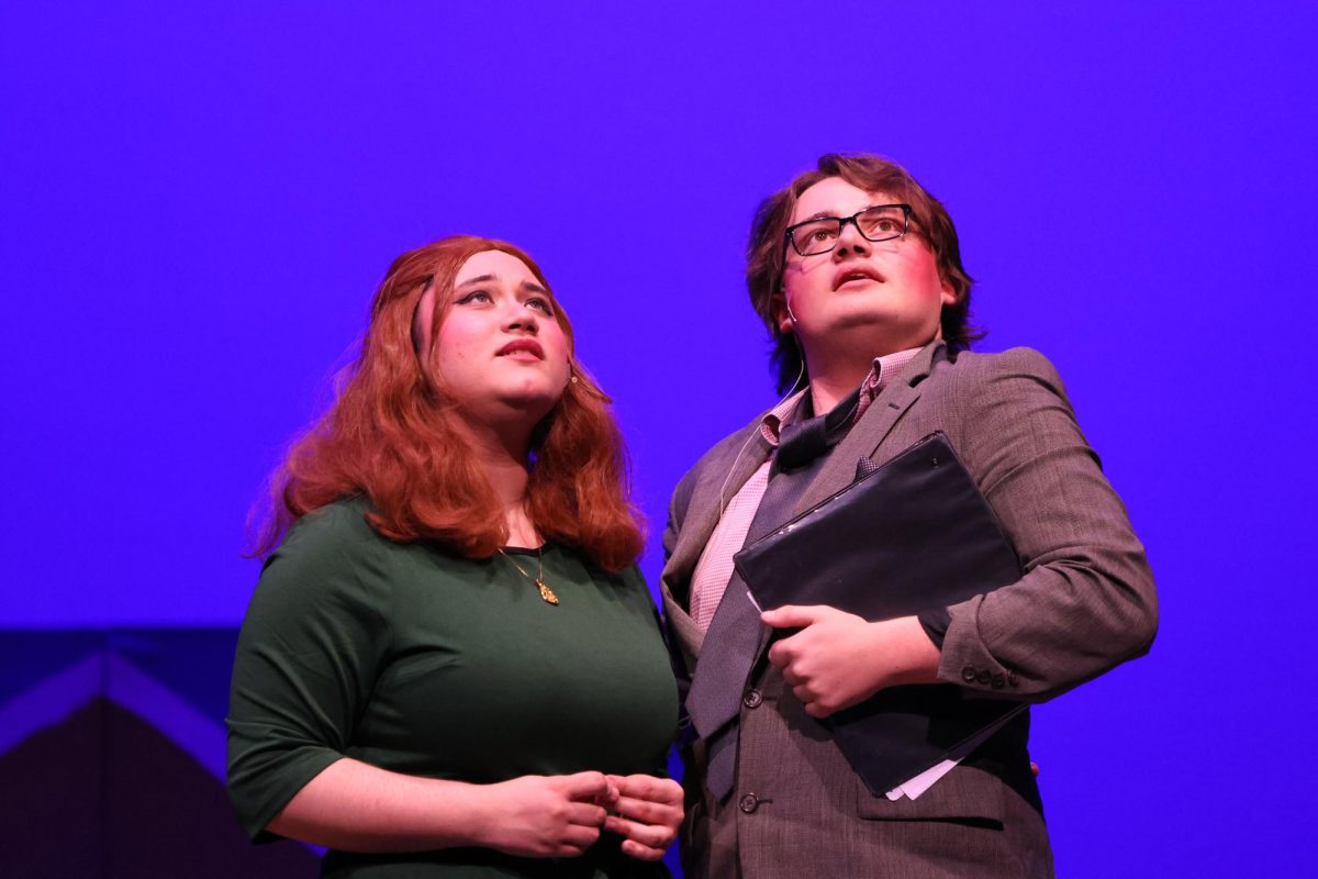 ADULTS IN CHARGE.  Senior Avalon Barreto and junior Aleczander Talkington play Rona Lisa and Vice Principal Panch. The two characters were the announcers of the spelling bee.